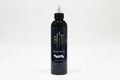 Black bottle with a white cap on a white background