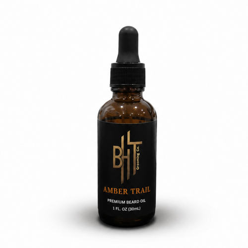 Brown bottle with black cap labeled 'Amber Trail' on a white background