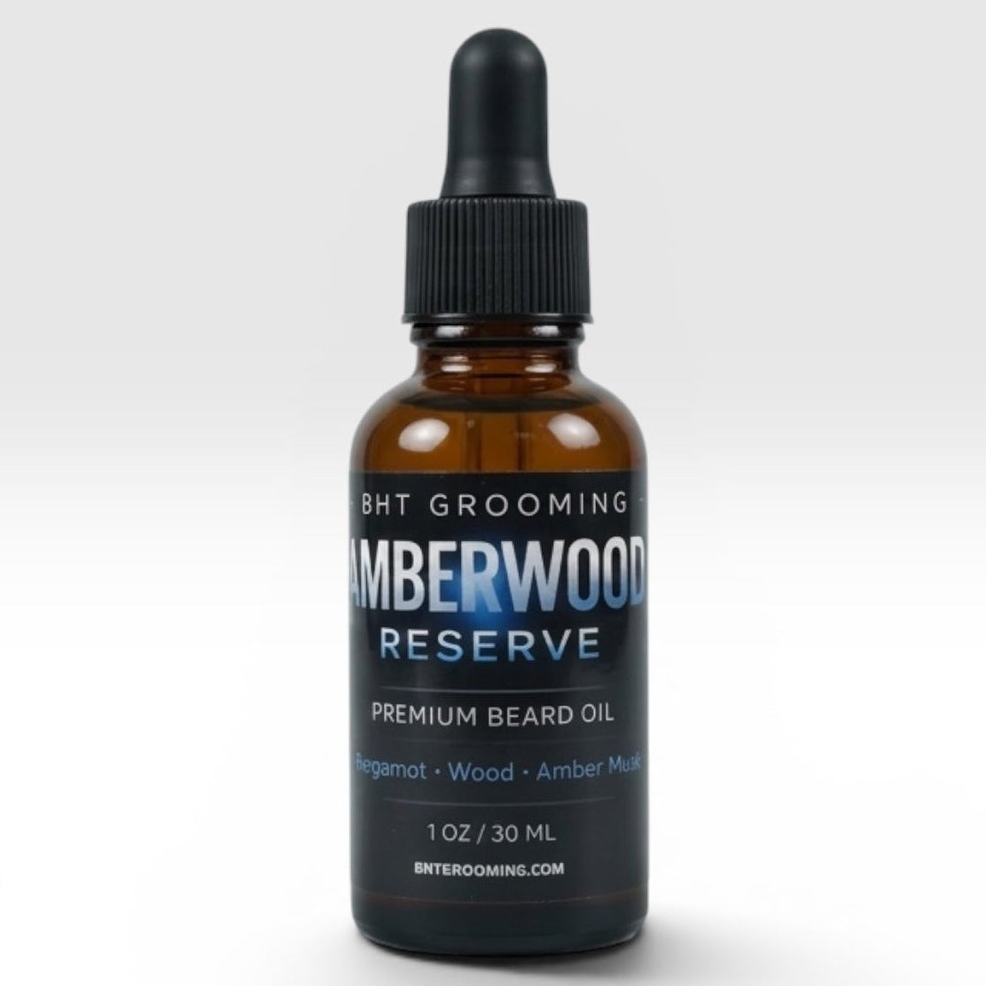 BHT Grooming Co. Amberwood Reserve beard oil in an amber glass dropper bottle with a black label.