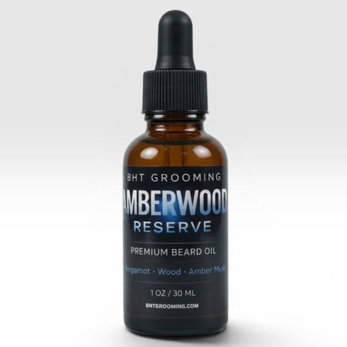 BHT Grooming Co. Amberwood Reserve beard oil in an amber glass dropper bottle with a black label.