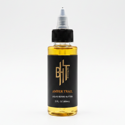 BHT Grooming Amber Trail Liquid Beard Butter in a 2 fl oz bottle with premium nourishing butters and oils to soften, condition, moisturize, and strengthen beards while promoting a healthy, natural shine.