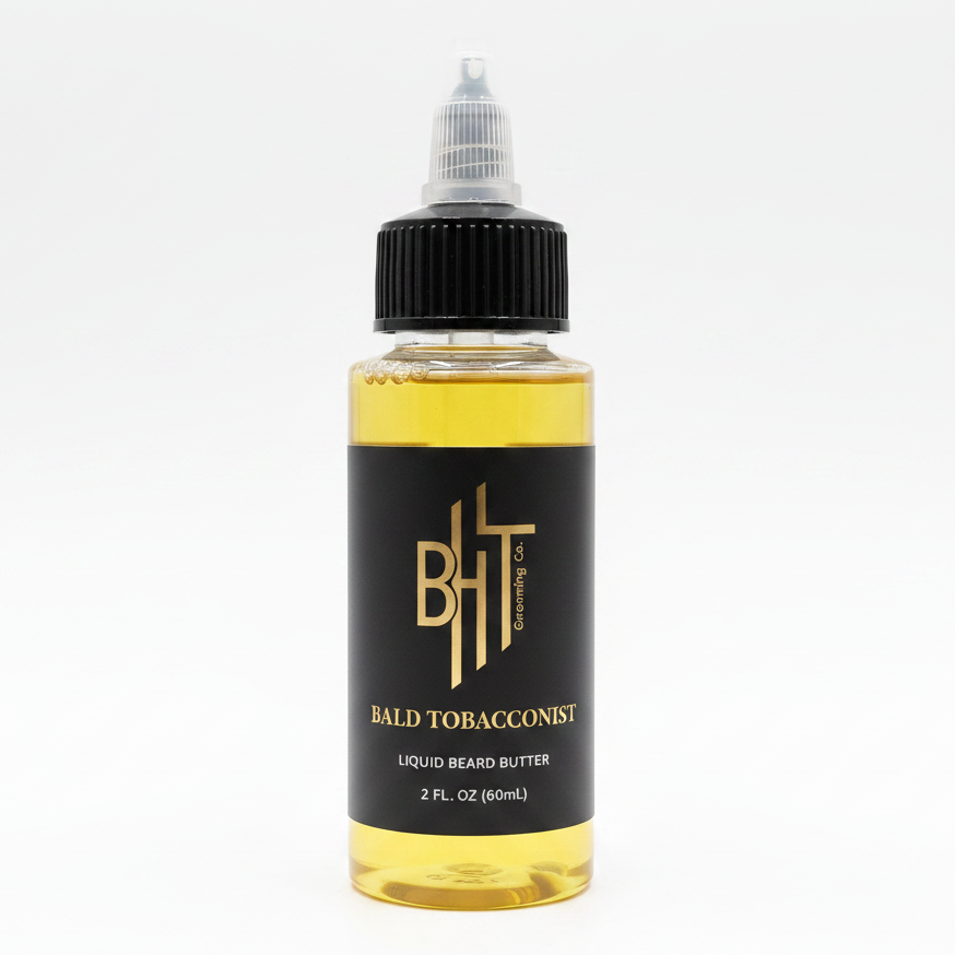 BHT Grooming Bald Tobacconist Liquid Beard Butter in a 2 fl oz bottle. Premium beard conditioner formulated to deeply moisturize, soften, and strengthen facial hair with a rich masculine fragrance of tobacco leaf and warm smoke.