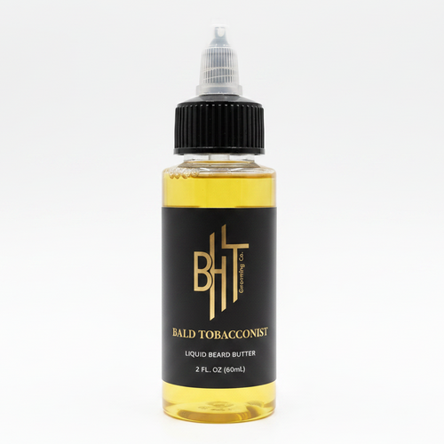 BHT Grooming Bald Tobacconist Liquid Beard Butter in a 2 fl oz bottle. Premium beard conditioner formulated to deeply moisturize, soften, and strengthen facial hair with a rich masculine fragrance of tobacco leaf and warm smoke.