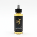 BHT Grooming Blue Suede Ember Liquid Beard Butter in a 2 fl oz bottle. Premium beard conditioner formulated to deeply moisturize, soften, strengthen, and nourish facial hair while reducing dryness, beard itch, and beard dandruff with a refined suede, amber, and woody - Bond. No 9 Bleecker Street inspired fragrance.