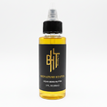 BHT Grooming Signature Status Liquid Beard Butter in a 2 fl oz bottle. Premium beard conditioner formulated to deeply moisturize, soften, strengthen, and nourish facial hair while reducing dryness, beard itch, and beard dandruff for a healthier, fuller beard. Creed Aventus inspired fragrance.