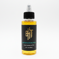 BHT Grooming Woody Oud Pecker Liquid Beard Butter in a 2 fl oz bottle. Premium beard conditioner formulated to deeply moisturize, soften, strengthen, and nourish facial hair with a luxurious blend of rare oud, guaiac wood, and cedarwood for a bold, smoky, masculine fragrance.