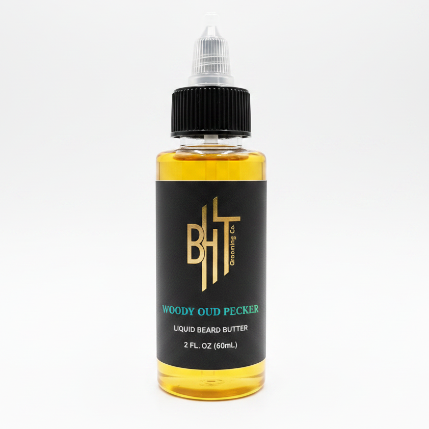 BHT Grooming Woody Oud Pecker Liquid Beard Butter in a 2 fl oz bottle. Premium beard conditioner formulated to deeply moisturize, soften, strengthen, and nourish facial hair with a luxurious blend of rare oud, guaiac wood, and cedarwood for a bold, smoky, masculine fragrance.